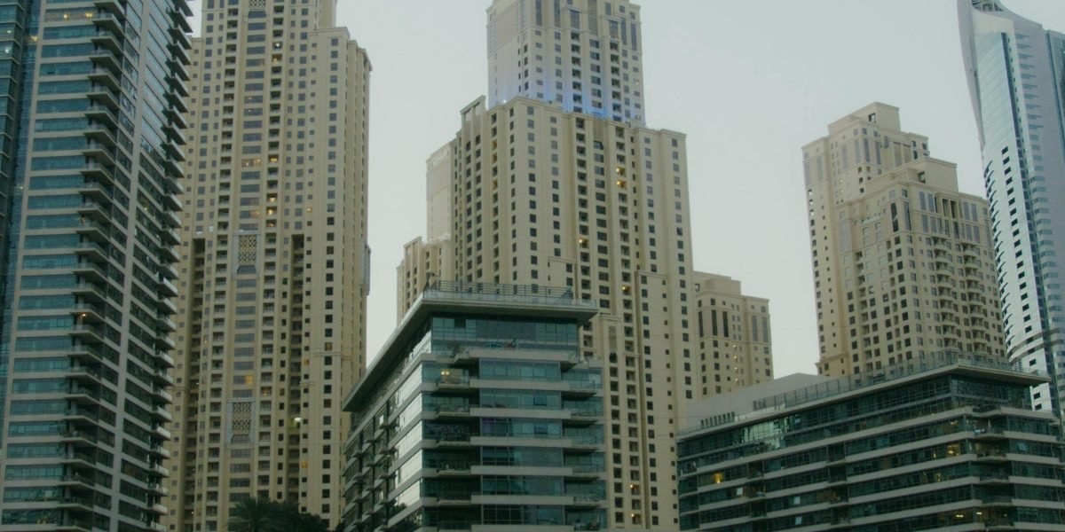 Dubai residential towers and waterfront at dusk